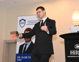 photo of Gleb Tsipursky giving keyone speech at a conference